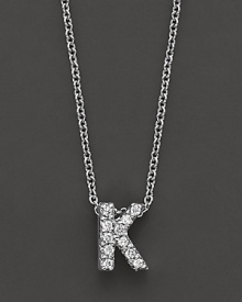 From the Tiny Treasures collection, a diamond K necklace. With signature ruby accent. Designed by Roberto Coin. From the Tiny Treasures collection, a diamond K necklace. With signature ruby accent. Designed by Roberto Coin.
