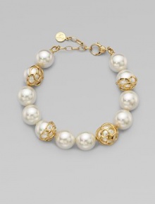 An exquisite strand of pearls accented with 18k gold flower cup caps.14mm round white organic man-made pearls18k goldplated sterling silverLength, about 7½ Lobster clasp closureImported An exquisite strand of pearls accented with 18k gold flower cup caps.14mm round white organic man-made pearls18k goldplated sterling silverLength, about 7½ Lobster clasp closureImported