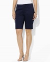 Designed for a flattering, slimming fit from lustrous stretch cotton sateen, these chic plus size Bermuda shorts from Lauren by Ralph Lauren are the epitome of timeless, preppy style.