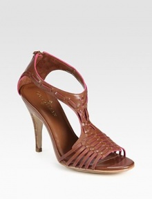 Tribal-inspired leather design with a skinny, stacked heel and exposed back zipper. Stacked heel, 4 (100mm)Leather upperExposed back zipperLeather lining and solePadded insoleImportedOUR FIT MODEL RECOMMENDS ordering true size. Tribal-inspired leather design with a skinny, stacked heel and exposed back zipper. Stacked heel, 4 (100mm)Leather upperExposed back zipperLeather lining and solePadded insoleImportedOUR FIT MODEL RECOMMENDS ordering true size.