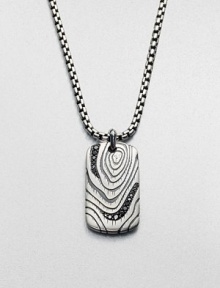 Casual elegance defines this sterling silver dog tag pendant with wood grain detail, tastefully adorned with black diamonds.Sterling silverBlack diamondLength, about 22Lobster claspImported Casual elegance defines this sterling silver dog tag pendant with wood grain detail, tastefully adorned with black diamonds.Sterling silverBlack diamondLength, about 22Lobster claspImported