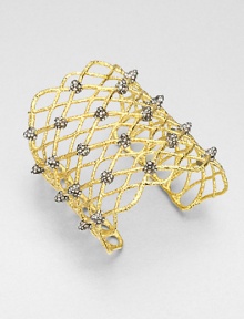 From the Elements Siyabona Collection. A wonderfully wide woven net pattern of textured goldtone, dotted with spikey clusters of dazzling Swarovski crystals.CrystalGoldtone and ruthenium platingDiameter, about 2.25 (adjustable)Width, about 3Imported From the Elements Siyabona Collection. A wonderfully wide woven net pattern of textured goldtone, dotted with spikey clusters of dazzling Swarovski crystals.CrystalGoldtone and ruthenium platingDiameter, about 2.25 (adjustable)Width, about 3Imported