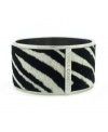 The sweet contrast of black and white creates a look that's both wild and wearable. Vince Camuto's chic cuff bracelet is crafted in silver tone mixed metal with a zebra print pony skin surface. Approximate diameter: 2 inches.