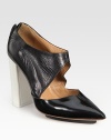 Elevated by a contrasting heel and island platform, this lustrous leather pump finishes the look with a cutout upper, point toe and exposed back zipper. Self-covered heel, 4 (100mm)Island platform, ½ (15mm)Compares to a 3½ heel (90mm)Leather upperPoint toeExposed back zipperLeather liningLeather and rubber solePadded insoleImported