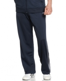 Warm up and cool down in the sleek sporty comfort of these fleece-lined go-to track pants from adidas. Warm up and cool down in the sleek sporty comfort of these fleece-lined go-to track pants from adidas.