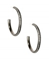 Givenchy glamorizes the look of classic hoop earrings with an array of glittering crystals. Crafted in hematite tone mixed metal. Approximate drop: 1-3/4 inches.