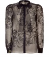 Embrace lush, ladylike luxe this season with Valentinos black silk blouse - Sumptuously soft, sheer fabric features a rich floral motif - Elegant tie neck style with small, stand up collar - Long, cuffed sleeves, gently peaked shoulders and decorative black trim -  Slim silhouette tapers gently through waist - Pair with pencil skirts, wide leg trousers and cigarette pants
