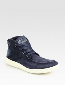 A remarkably cool lace-up with urban appeal designed in slightly-distressed canvas and suede.Canvas/suede upperPadded insoleRubber soleImported A remarkably cool lace-up with urban appeal designed in slightly-distressed canvas and suede.Canvas/suede upperPadded insoleRubber soleImported