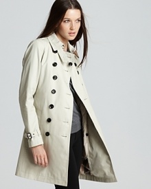 The classic Burberry Brit trench coat gains cold-weather credo with an inner warmer for a cozy yet chic approach to the rainiest of days. The classic Burberry Brit trench coat gains cold-weather credo with an inner warmer for a cozy yet chic approach to the rainiest of days.