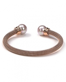Majorica's rose gold bangle exudes cool confidence. Solo or stacked, wear yours at cocktail hour to give night time looks a strong spin. Majorica's rose gold bangle exudes cool confidence. Solo or stacked, wear yours at cocktail hour to give night time looks a strong spin.