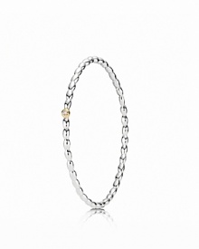 A dazzling diamond set in a 14K gold bezel catches the eye on PANDORA's beaded sterling silver bangle. A dazzling diamond set in a 14K gold bezel catches the eye on PANDORA's beaded sterling silver bangle.