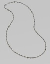 A long, elegant chain of oxidized sterling silver is richly dotted with rough pyrite beads.Pyrite Oxidized sterling silver Length, about 18 Spring ring clasp Made in USA