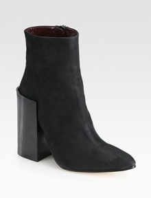 An exaggerated wooden heel heightens this modern leather ankle boot with a subtle point toe. Wooden heel, 4¾ (120mm)Leather upperPoint toeSide zipLeather lining and solePadded insoleMade in Italy An exaggerated wooden heel heightens this modern leather ankle boot with a subtle point toe. Wooden heel, 4¾ (120mm)Leather upperPoint toeSide zipLeather lining and solePadded insoleMade in Italy