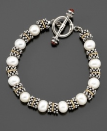 Wrap your wrist in pure elegance with this classic pearl (8.5-9mm) and silver beaded bracelet. With 14k gold accents. Measures 8 long. Wrap your wrist in pure elegance with this classic pearl (8.5-9mm) and silver beaded bracelet. With 14k gold accents. Measures 8 long.