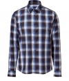 Stylish dress shirt in fine, pure cotton - Soft yet durable, lighter weight material - Classic plaid motif in rich shades of blue - Small collar, long cuffed sleeves and full button placket - Slim, slightly tapered silhouette - Casually elegant and ultra-versatile - Pair with chinos, shorts or jeans