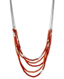 Make your presence known. Kenneth Cole New York's chic statement necklace features several rows of red and silver tone seed beads. Set in silver tone mixed metal. Approximate length: 16 inches + 3-inch extender. Approximate drop: 2 inches.