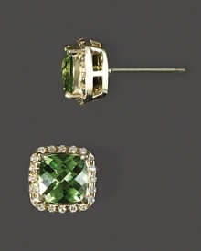 Diamonds frame faceted peridot, set in 14K yellow gold. Diamonds frame faceted peridot, set in 14K yellow gold.