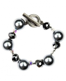 Dressy and decorative. Enhance your workday wardrobe with AK Anne Klein's elegant toggle bracelet. Featuring lustrous imitation gray pearls accented by fashionably faceted beads, it's made in hematite tone mixed metal. Approximate length: 7-1/2 inches. Dressy and decorative. Enhance your workday wardrobe with AK Anne Klein's elegant toggle bracelet. Featuring lustrous imitation gray pearls accented by fashionably faceted beads, it's made in hematite tone mixed metal. Approximate length: 7-1/2 inches.