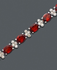 A tennis bracelet to die for. Bold oval-cut garnet (17 ct. t.w.) and diamond-accented links add instant drama. Bracelet crafted in sterling silver. Approximate length: 7 inches. A tennis bracelet to die for. Bold oval-cut garnet (17 ct. t.w.) and diamond-accented links add instant drama. Bracelet crafted in sterling silver. Approximate length: 7 inches.