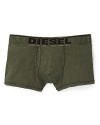These classic cut Diesel boxer trunks in fatigue green feature a bold logo waistband.