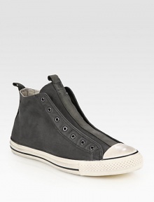 Canvas high-top design with a contrasting rubber toecap and sole, modernized by a laceless front. Leather liningPadded insoleRubber soleImported Canvas high-top design with a contrasting rubber toecap and sole, modernized by a laceless front. Leather liningPadded insoleRubber soleImported