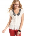 Gear-up for work or play in this beaded Peter-Pan collar top from Jessica Simpson!