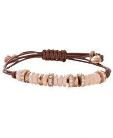 Breezy and bohemian. Fossil's free-spirited style combines river shells in pretty peach hues, sparkling crystal beads, a natural leather cord, and rose gold tone mixed metal accents. Approximate diameter: 2-1/2 inches. Breezy and bohemian. Fossil's free-spirited style combines river shells in pretty peach hues, sparkling crystal beads, a natural leather cord, and rose gold tone mixed metal accents. Approximate diameter: 2-1/2 inches.