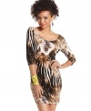 Hypnotic, animal-inspired print creates abstract art on a dress that totally highlights your curves! From Sugar & Spice.