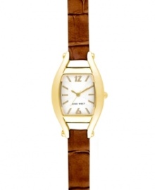 A timely take on a vintage silhouette, by Nine West. Crafted of textured brown leather strap and cushion-shaped gold tone mixed metal case. Silver tone dial with swirling design features gold tone applied stick indices, numerals at twelve and six o'clock, gold tone hour and minute hands, sweeping second hand and logo at six o'clock. Quartz movement. Limited lifetime warranty. A timely take on a vintage silhouette, by Nine West. Crafted of textured brown leather strap and cushion-shaped gold tone mixed metal case. Silver tone dial with swirling design features gold tone applied stick indices, numerals at twelve and six o'clock, gold tone hour and minute hands, sweeping second hand and logo at six o'clock. Quartz movement. Limited lifetime warranty.