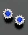 Earrings from the Effy Collection create a rich, regal look. Royalty-inspired stud earrings feature round-cut sapphires (5/8 ct. t.w.) surrounded by sparkling round-cut diamonds (1/4 ct. t.w.). Crafted in 14k white gold. Approximate diameter: 1/3 inch.