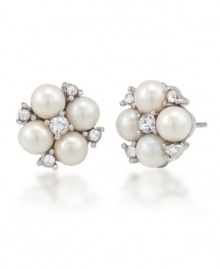 Pearl perfection. Luminous imitation pearls yield timeless elegance for Carolee's small cluster button earrings. Crafted in silver tone mixed metal, they're adorned with sparkling glass accents. Approximate diameter: 1/2 inch. Pearl perfection. Luminous imitation pearls yield timeless elegance for Carolee's small cluster button earrings. Crafted in silver tone mixed metal, they're adorned with sparkling glass accents. Approximate diameter: 1/2 inch.