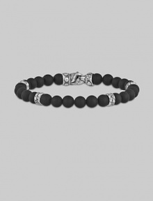 A strand of dramatic matte-finish black onyx beads, with a bold clasp and stations of hand-forged sterling silver.8mm matte onyx beads Sterling silver Length, about 9 Lobster clasp Made in USA