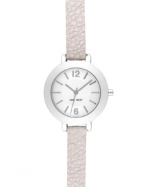 Crisp and refined watch in a slim silhouette from Nine West. Crafted of white leather strap and round silver tone mixed metal case. Silver tone dial features applied stick indices, numerals at twelve and six o'clock, hour and minute hands, sweeping second hand and logo at six o'clock. Quartz movement. Limited lifetime warranty. Crisp and refined watch in a slim silhouette from Nine West. Crafted of white leather strap and round silver tone mixed metal case. Silver tone dial features applied stick indices, numerals at twelve and six o'clock, hour and minute hands, sweeping second hand and logo at six o'clock. Quartz movement. Limited lifetime warranty.