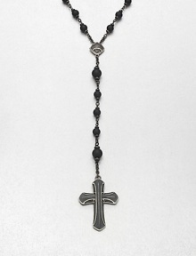 A simple, yet masculine addition to your ensemble, with a strand black onyx beads complemented by a sterling silver cross pendant.Sterling silverBlack onyxAbout 37, inner diam.About 7 dropImported