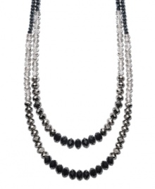 Add a designer element to your look in dramatic, dark hues. c.A.K.e. by Ali Khan necklace features two, graduated rows of jet and hematite-colored glass beads with a mixed metal clasp. Approximate length: 24 inches + 3-1/4-inch extender. Add a designer element to your look in dramatic, dark hues. c.A.K.e. by Ali Khan necklace features two, graduated rows of jet and hematite-colored glass beads with a mixed metal clasp. Approximate length: 24 inches + 3-1/4-inch extender.