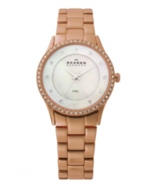 Smooth steel gets a warm makeover on this watch by Skagen Denmark. Rose-gold-plated stainless steel bracelet and round case. Bezel crystallized with Swarovski elements. Mother-of-pearl dial features crystal accents at markers, three silver tone hands and black logo at twelve o'clock. Quartz movement. Water resistant to 30 meters. Limited lifetime warranty. Smooth steel gets a warm makeover on this watch by Skagen Denmark. Rose-gold-plated stainless steel bracelet and round case. Bezel crystallized with Swarovski elements. Mother-of-pearl dial features crystal accents at markers, three silver tone hands and black logo at twelve o'clock. Quartz movement. Water resistant to 30 meters. Limited lifetime warranty.