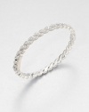 Graceful crystal-set feather shapes come together to form an elegant hinged bangle with shimmer that goes on and on.CrystalRhodium platingDiameter, about 2½Width, about ¼Box-and-tongue claspImported