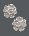 Flaunt fabulous style in sparkling flowers. Stud earrings feature round-cut diamonds (1/2 ct. t.w.) in sterling silver. Approximate diameter: 1/2 inch.