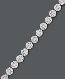 This style will certainly grow on you. Intricate, clustered flowers shine with the addition of round-cut diamonds (2 ct. t.w.) in this stunning tennis bracelet. Crafted in 14k white gold. Approximate length: 7-1/4 inches. This style will certainly grow on you. Intricate, clustered flowers shine with the addition of round-cut diamonds (2 ct. t.w.) in this stunning tennis bracelet. Crafted in 14k white gold. Approximate length: 7-1/4 inches.