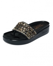 Meet the sophisticated side of casual: Fifi. Donald J Pliner elevates the classic thong sandal with a stacked platform wedge and ornate beading. Meet the sophisticated side of casual: Fifi. Donald J Pliner elevates the classic thong sandal with a stacked platform wedge and ornate beading.