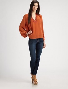 Feather-light silk v-neck has embroidered trim and long bishop sleeves. V-neckLong bishop sleevesSplit back yokeSilkDry cleanImportedModel shown is 5'10 (177cm) wearing US size Small. Feather-light silk v-neck has embroidered trim and long bishop sleeves. V-neckLong bishop sleevesSplit back yokeSilkDry cleanImportedModel shown is 5'10 (177cm) wearing US size Small.