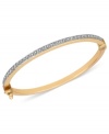 A beautiful statement. This bangle bracelet is crafted from 14k gold with diamond accents adding to the sparkle. Approximate diameter: 1-5/8 inches x 1-3/8 inches.