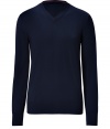 Must-have piece for fall, this classic navy v-neck pullover is a versatile favorite of the season - Made of pure wool for optimal warmth and comfort - Long, slender sleeves, small v-neck and moderately long hem - Looks great solo or as a laying piece - Pair with jeans and khakis for causal, polished looks