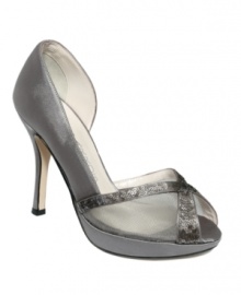 X marks the spot. Two criss-crossing swaths of sequin light up the one-of-a-kind design of the Xen evening pumps by Caparros. X marks the spot. Two criss-crossing swaths of sequin light up the one-of-a-kind design of the Xen evening pumps by Caparros.