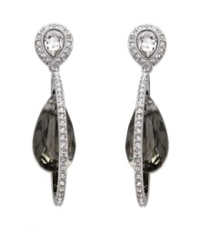 Dawn to dusk elegance. Swarovski's pierced earrings radiate timeless sophistication. A black crystal dangles within a silver tone mixed metal drop. A touch of clear crystal pavé adds an exquisite sparkle. Approximate drop: 1-5/8 inches. Dawn to dusk elegance. Swarovski's pierced earrings radiate timeless sophistication. A black crystal dangles within a silver tone mixed metal drop. A touch of clear crystal pavé adds an exquisite sparkle. Approximate drop: 1-5/8 inches.