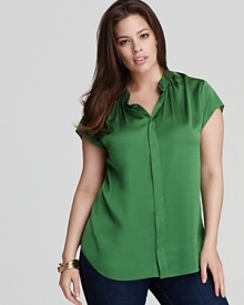 Set off your 9-to-5 style with a decadent rush of jewel tone in this VINCE CAMUTO Plus blouse. Let the dazzling shade shine against crisp, navy trousers for vibrant polish.