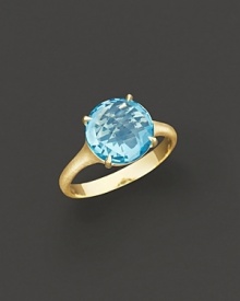 18K yellow gold is set with a faceted blue topaz. 18K yellow gold is set with a faceted blue topaz.