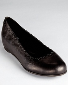 Eileen Fisher's feminine, scalloped-edge flats conceal a hidden wedge for a light lift. Eileen Fisher's feminine, scalloped-edge flats conceal a hidden wedge for a light lift.