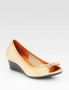 Stitched leather design with a slight wedge, peep toe and subtle bow embellishment. Self-covered wedge, 1½ (40mm)Leather upperLeather liningRubber solePadded insoleImportedOUR FIT MODEL RECOMMENDS ordering true size. Stitched leather design with a slight wedge, peep toe and subtle bow embellishment. Self-covered wedge, 1½ (40mm)Leather upperLeather liningRubber solePadded insoleImportedOUR FIT MODEL RECOMMENDS ordering true size.
