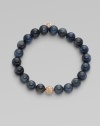 This kyanite beaded, stretch design is accented with a diamond embellished 14k rose gold ball for a simply chic style. Kyanite beads14K rose goldDiamonds, .1 tcwLength, about 6¾Elastic slip-on styleMade in USA of imported materials